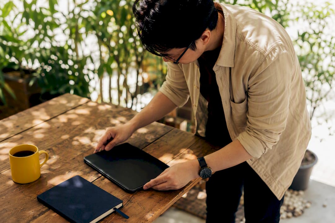 Marketer adjusting digital form on tablet