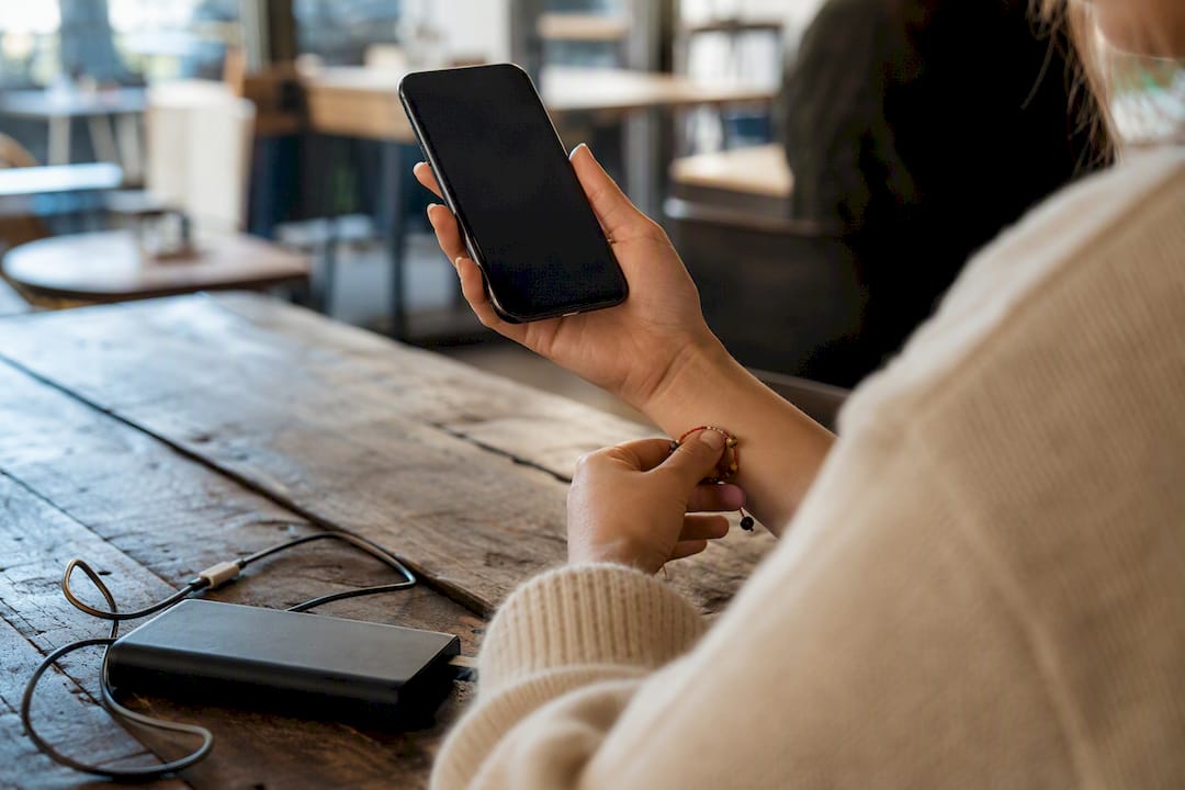 Envision Marketing Agency | Medical Practice SEO: 90 Day Local First Plan to Win Patients Hands holding phone with inactive screen symbolizing slow load